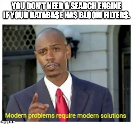 Dave Chappelle meme with caption 'YOU DON'T NEED A SEARCH ENGINE IF YOUR DATABASE HAS BLOOM FILTERS' and bottom text 'Modern problems require modern solutions'. Shows Chappelle in a suit with red tie gesturing as if making a point.