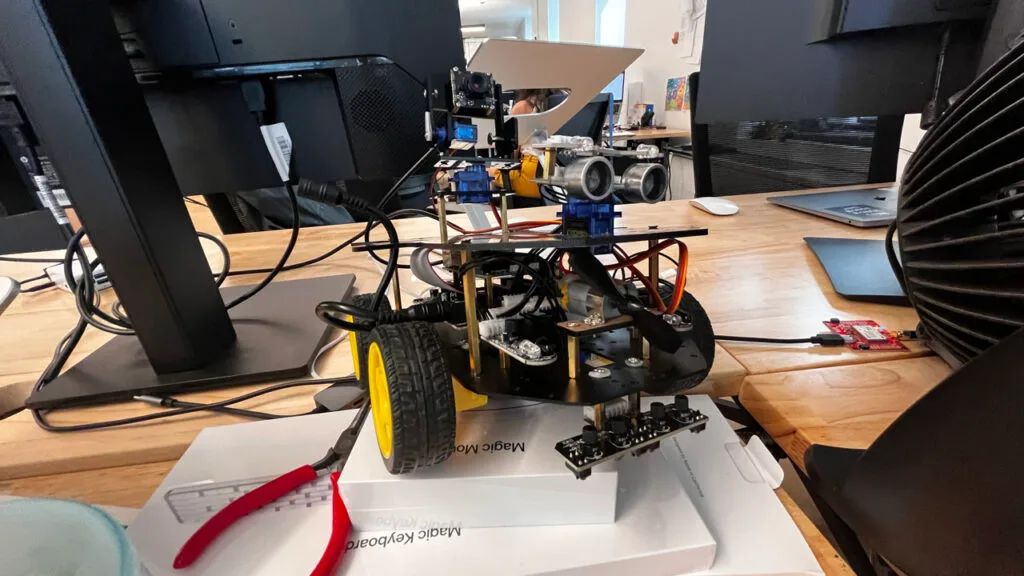 A four wheeled robot ready to be driven around remotely.